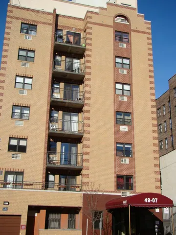 a front view of a building with glass windows