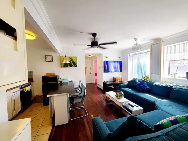 a living room with furniture and a window