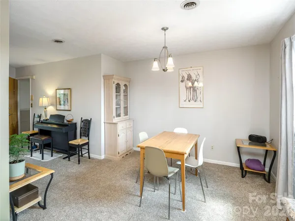 a kitchen with stainless steel appliances granite countertop a refrigerator stove and sink