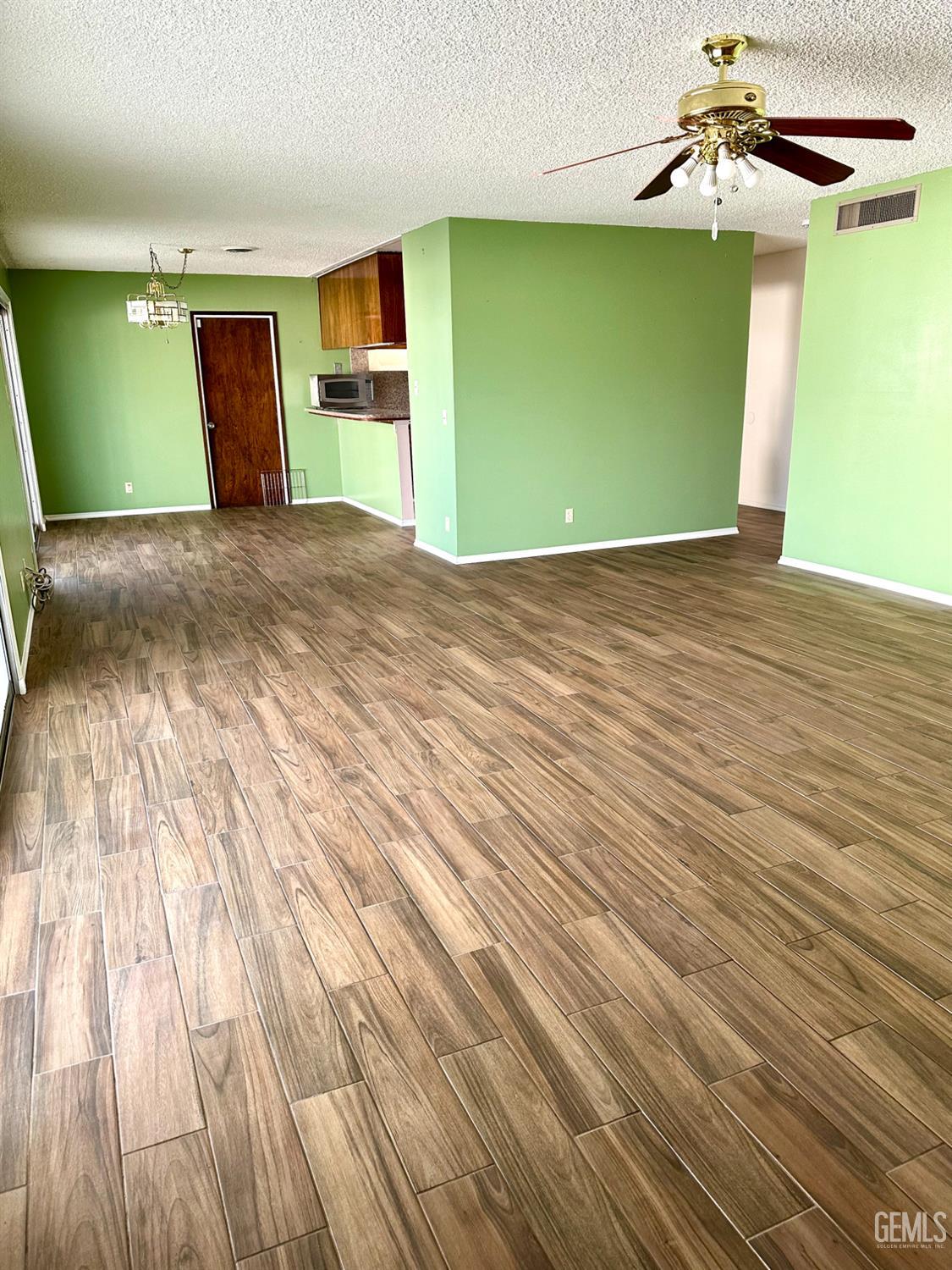 Undisclosed Address Delano, CA 93215 - Photo 14 of 14 a view of a big room with wooden floor