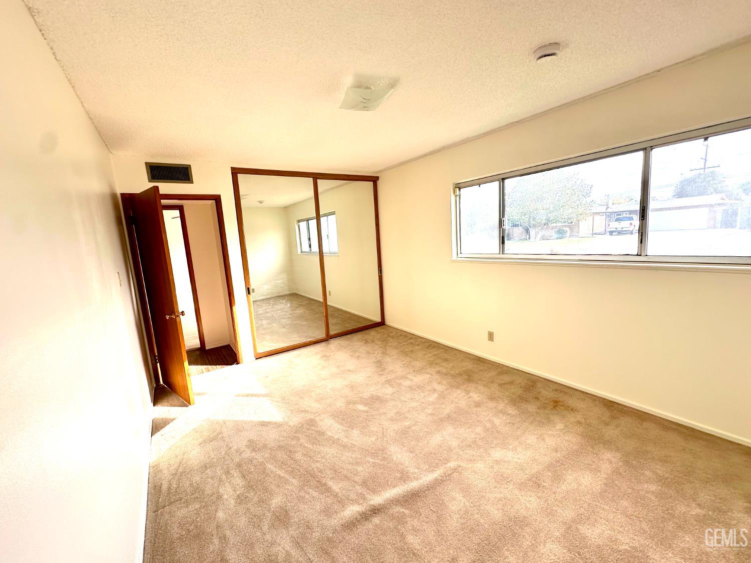 Undisclosed Address Delano, CA 93215 - Photo 3 of 14 a view of an empty room with a window