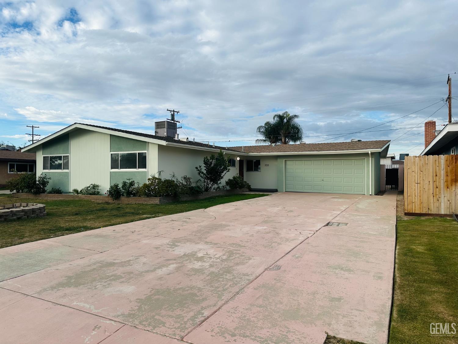 Undisclosed Address Delano, CA 93215 - Photo 8 of 14 a front view of a house with garden