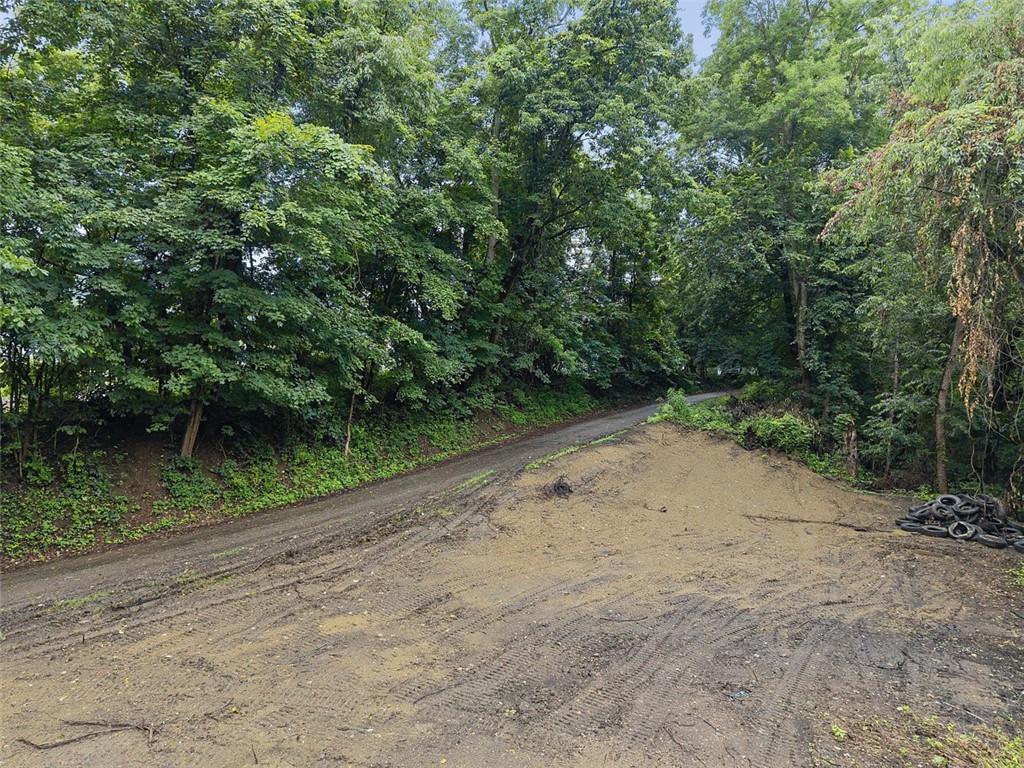 199 Allison Road Shippingport, PA 15077 - Photo 7 of 15 a view of a dirt road with trees in the background