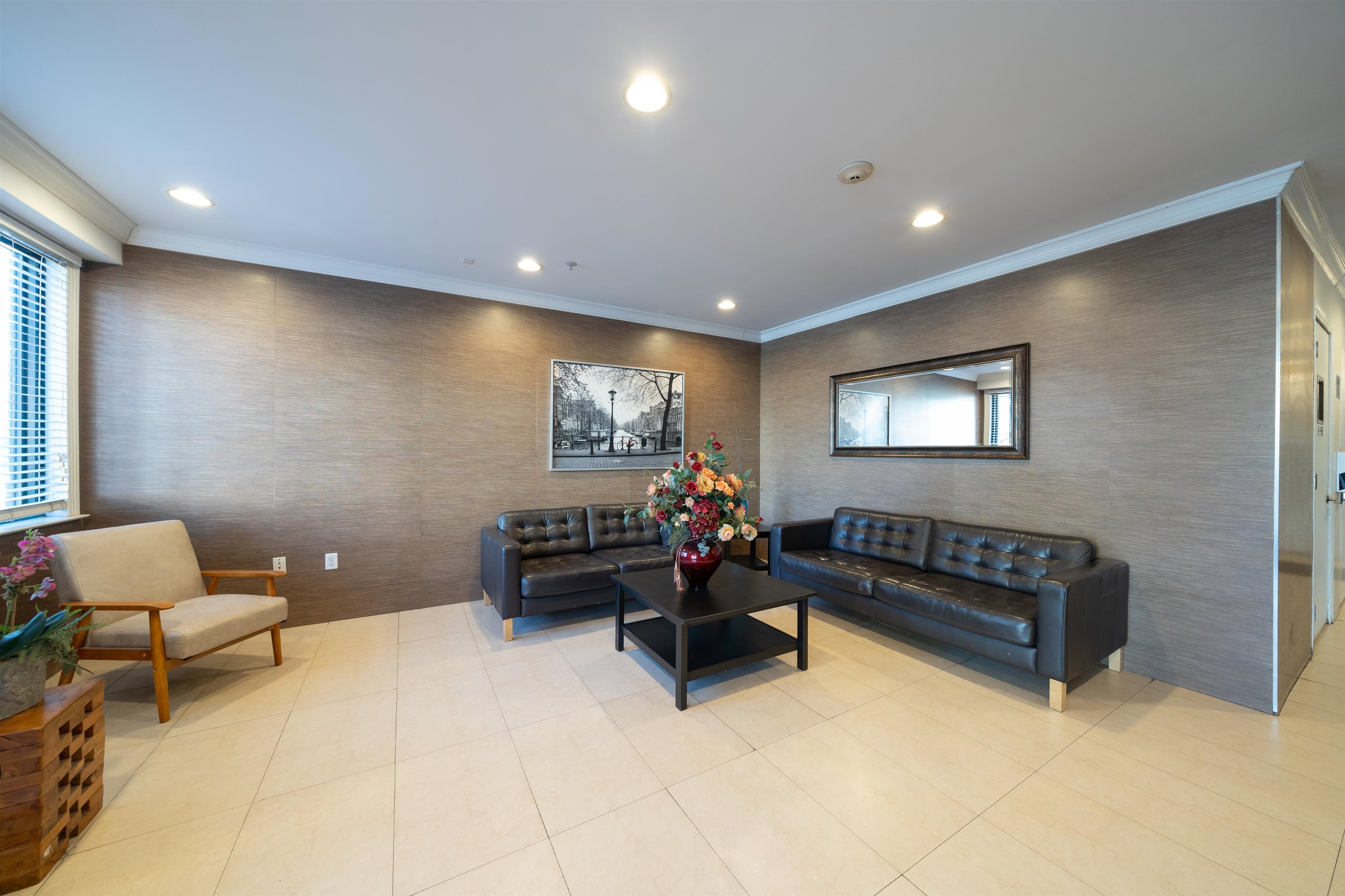 85 Maple Street, Unit 2L Weehawken, NJ 07086 - Photo 9 of 11 a living room with furniture and a flat screen tv