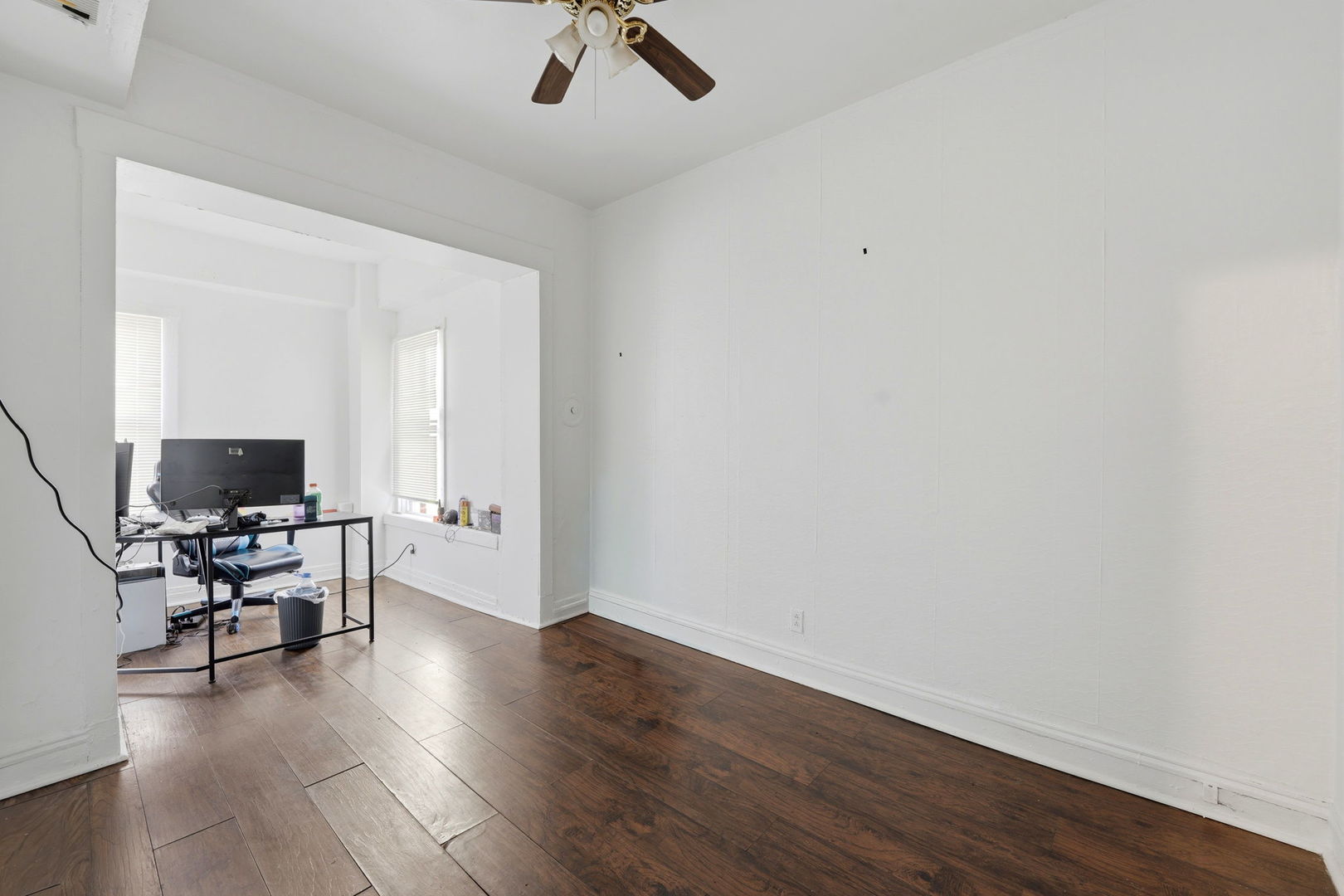 7923 South Carpenter Street Chicago, IL 60620 - Photo 18 of 34 a view of a workspace with furniture and wooden floor