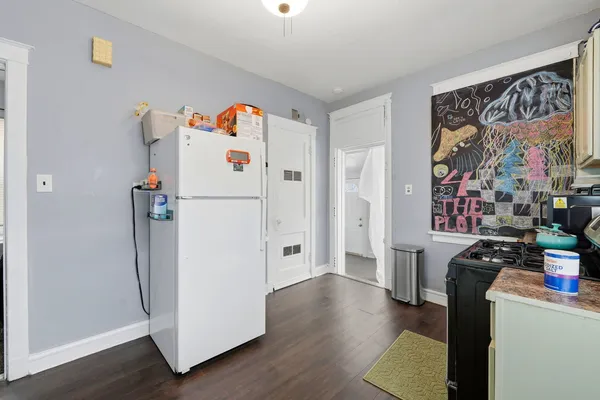 a kitchen with cabinets and appliances