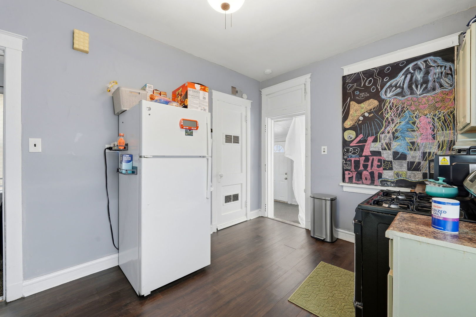 7923 South Carpenter Street Chicago, IL 60620 - Photo 20 of 34 a white refrigerator freezer sitting inside of a kitchen