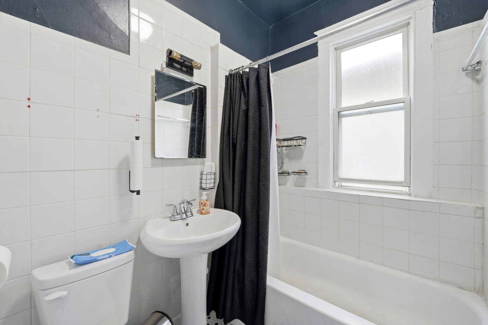 7923 South Carpenter Street Chicago, IL 60620 - Photo 22 of 34 a bathroom with a sink toilet and shower