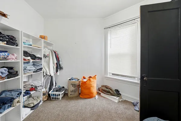 a view of a livingroom with gym equipment