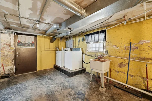 a view of a house with iron fence