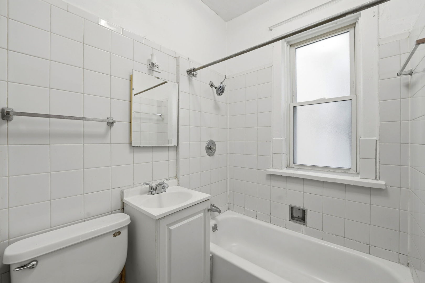 7923 South Carpenter Street Chicago, IL 60620 - Photo 8 of 34 a bathroom with a sink a toilet and shower