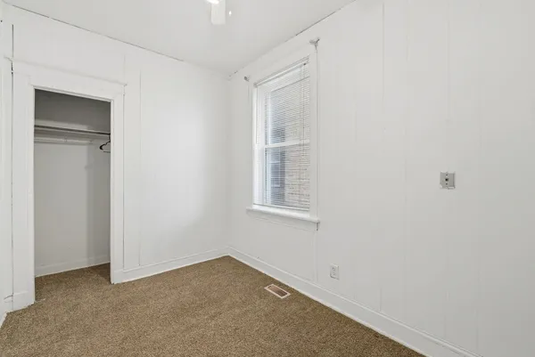 a view of a room that has a window in it