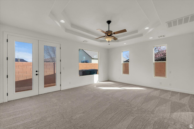 691 Rainier Drive St. George, UT 84770 - Photo 5 of 24 Spare room with ceiling fan, light carpet, french doors, and recessed lighting