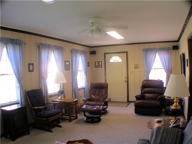 1077 Liberty Road Winchester, TN 37398 - Photo 13 of 20 Bonus room is attached to rear of home and has carpet, ceiling fan, and plenty of windows for natural light.