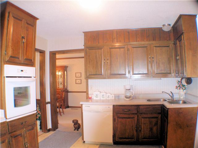 1077 Liberty Road Winchester, TN 37398 - Photo 9 of 20 The kitchen has a nice flow with plenty of cabinets and a unique corner sink.