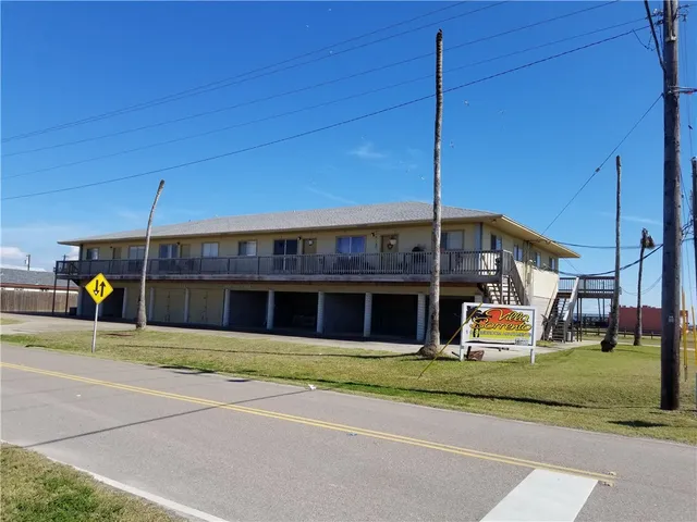a view of a house with a backyard and porch