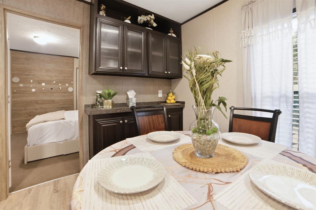 127 Almond Road Minden, LA 71055 - Photo 9 of 25 a kitchen with a table and chair