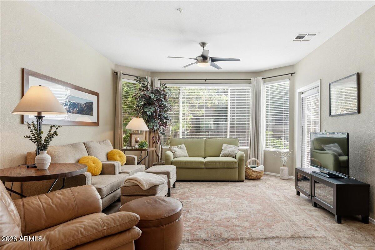 435 West Rio Salado Parkway, Unit 111 Tempe, AZ 85281 - Photo 11 of 44 a living room with furniture large window and a flat screen tv