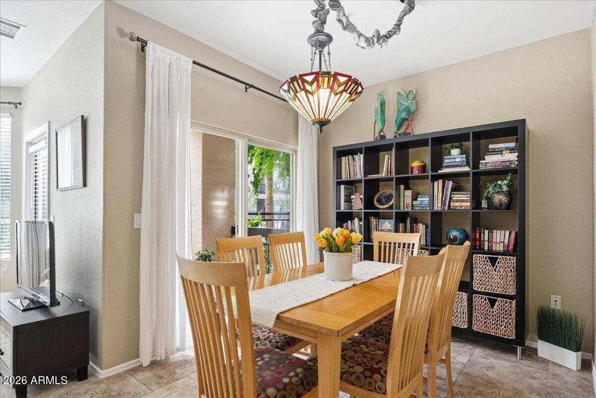 435 West Rio Salado Parkway, Unit 111 Tempe, AZ 85281 - Photo 17 of 44 a view of a dining room with furniture window and wooden floor