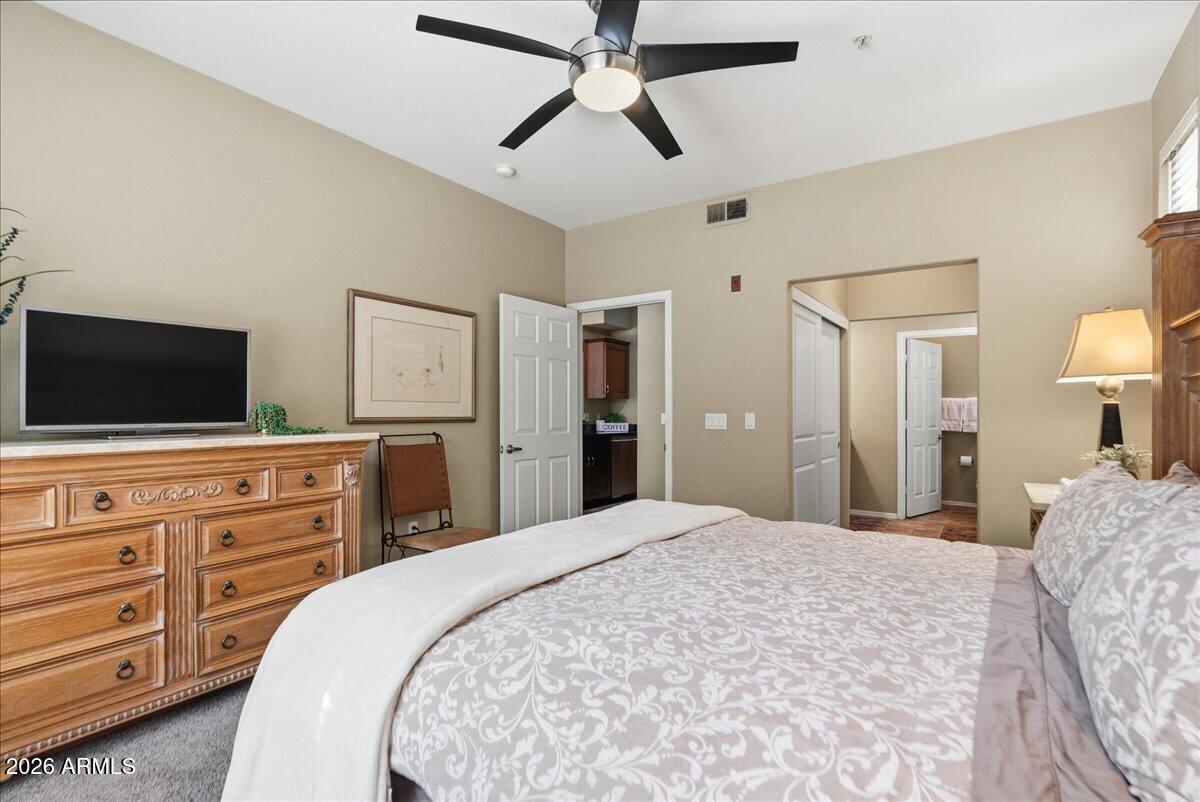 435 West Rio Salado Parkway, Unit 111 Tempe, AZ 85281 - Photo 19 of 44 a bedroom with a bed and a flat screen tv