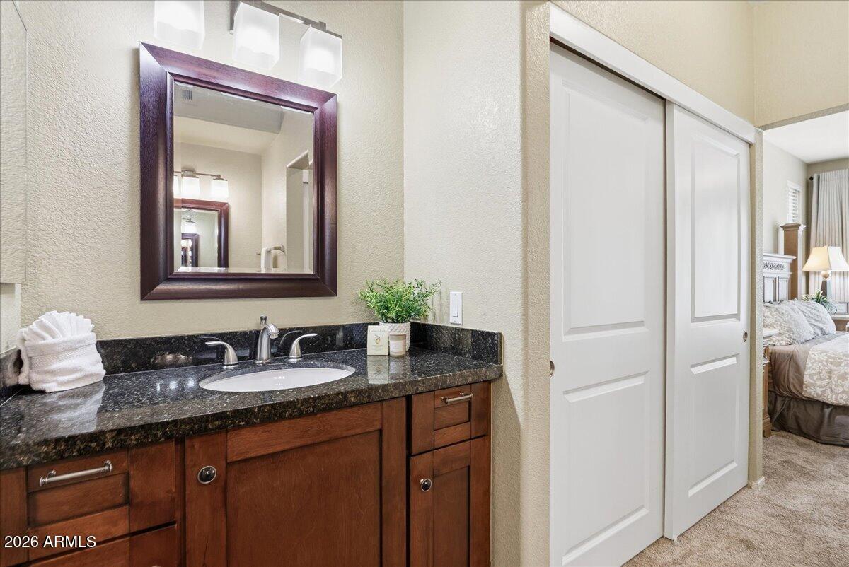 435 West Rio Salado Parkway, Unit 111 Tempe, AZ 85281 - Photo 22 of 44 a bathroom with a granite countertop sink and a mirror