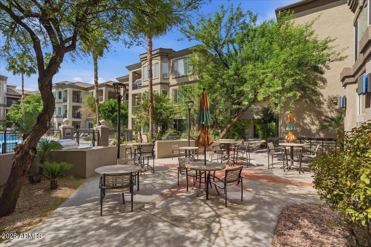 435 West Rio Salado Parkway, Unit 111 Tempe, AZ 85281 - Photo 36 of 44 a view of a patio with a table and chairs and potted plants