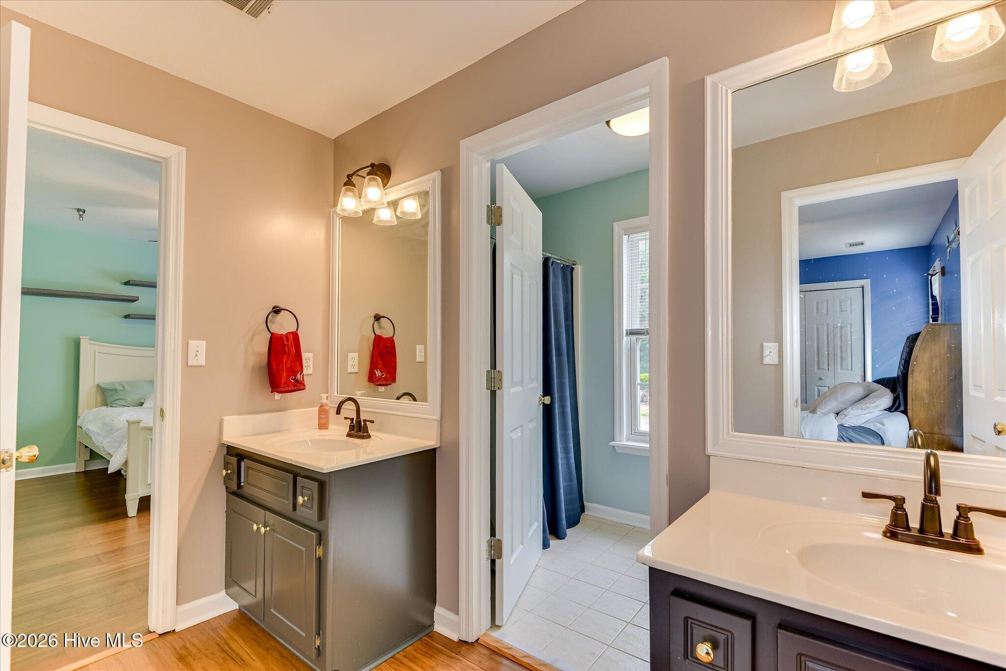 4480 Cape Cod Drive Evans, GA 30809 - Photo 22 of 55 Full Bath in Secondary Bedroom areas, Double Sinks with Separate tub/toilet room. Entrances into 2 secondary bedrooms is the ultimate convenience!