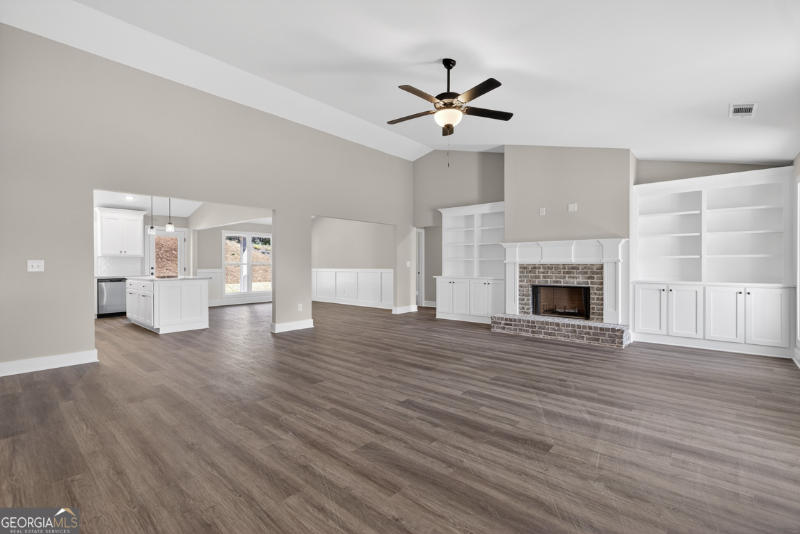 97 Wards Creek Road, Unit 1 Toccoa, GA 30577 - Photo 4 of 55 a view of a livingroom with wooden floor and a ceiling fan