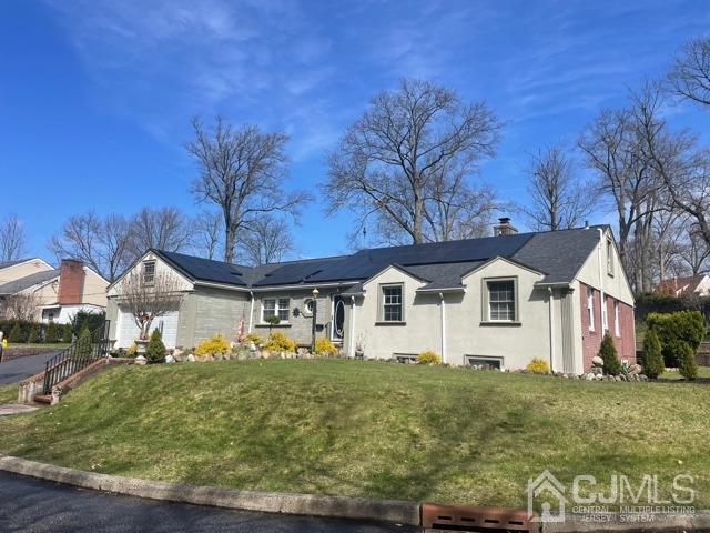 100 Valley Road Colonia, NJ 07067 - Photo 1 of 18 a front view of a house with garden