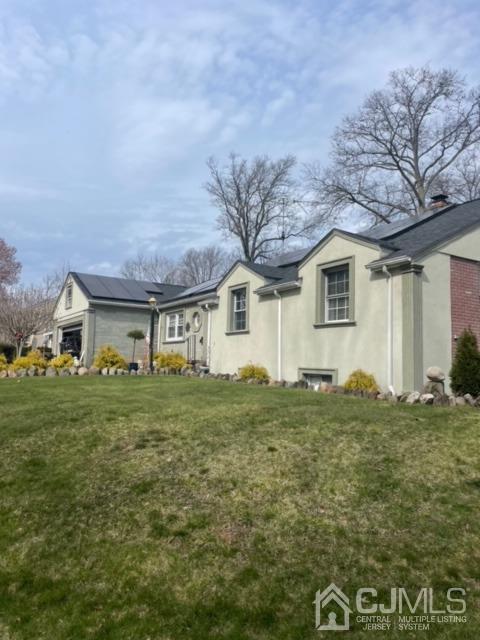 100 Valley Road Colonia, NJ 07067 - Photo 2 of 18 a front view of a house with a garden