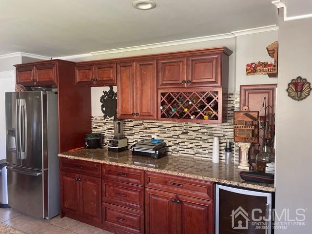 100 Valley Road Colonia, NJ 07067 - Photo 7 of 18 a kitchen with stainless steel appliances granite countertop a refrigerator and a stove top oven