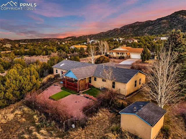 an aerial view of residential houses with outdoor space