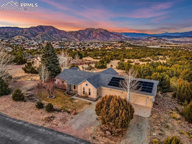a view of a city with mountains in the background