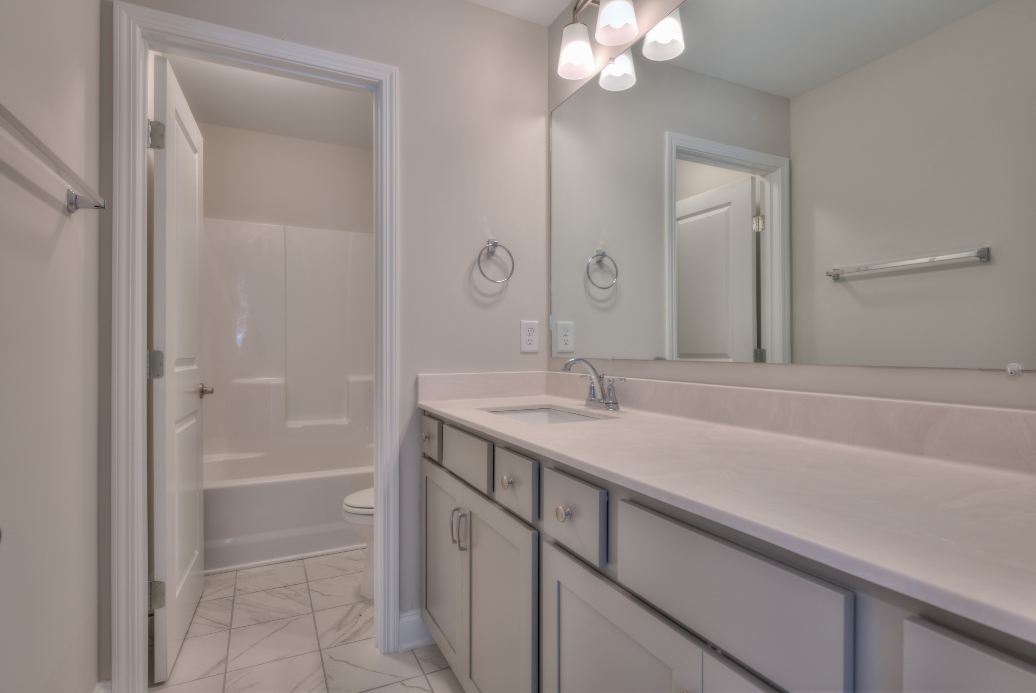 9012 Headwaters Drive Franklin, TN 37064 - Photo 18 of 25 a bathroom with a sink a vanity and a mirror