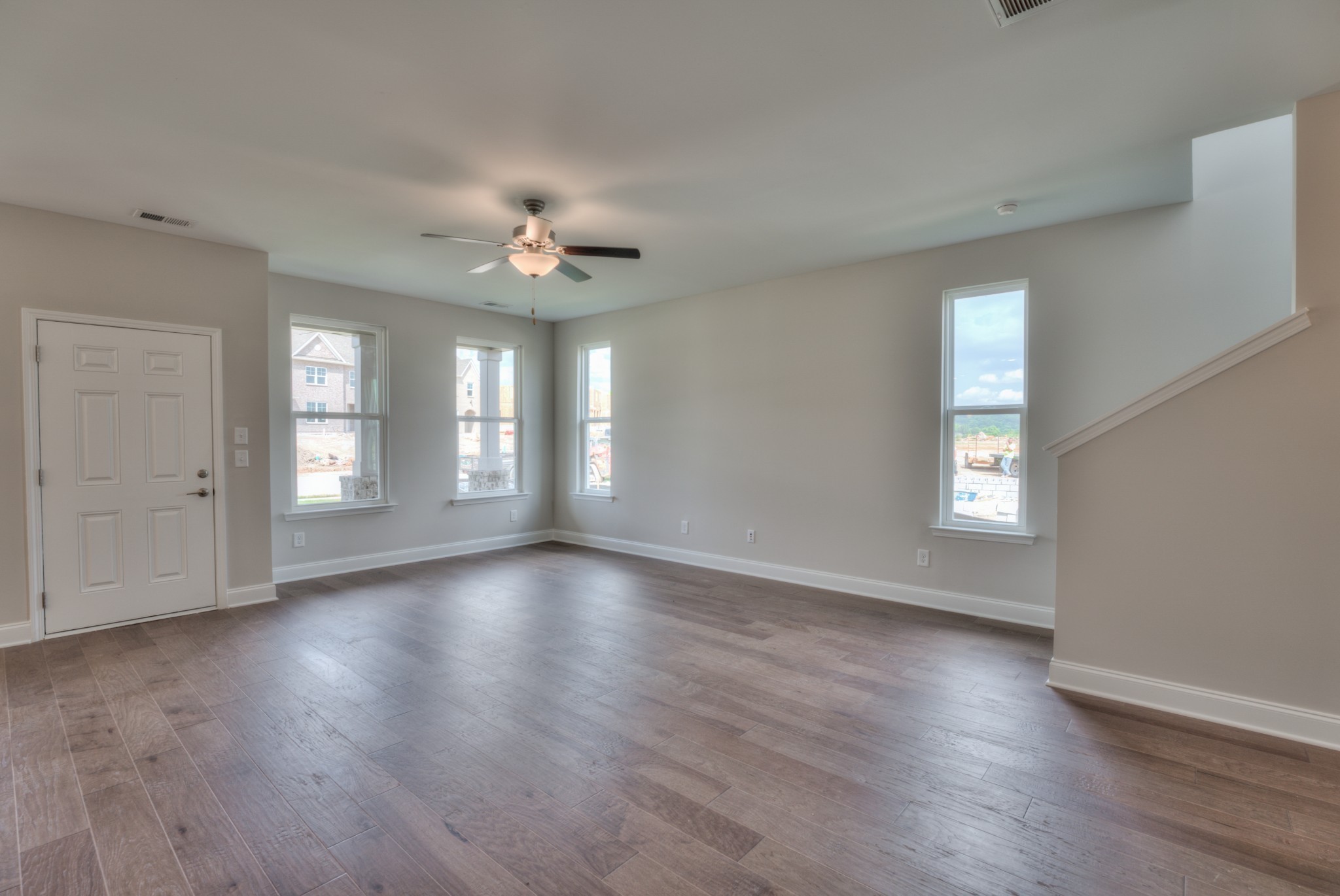 9012 Headwaters Drive Franklin, TN 37064 - Photo 8 of 25 a view of an empty room with window and wooden floor