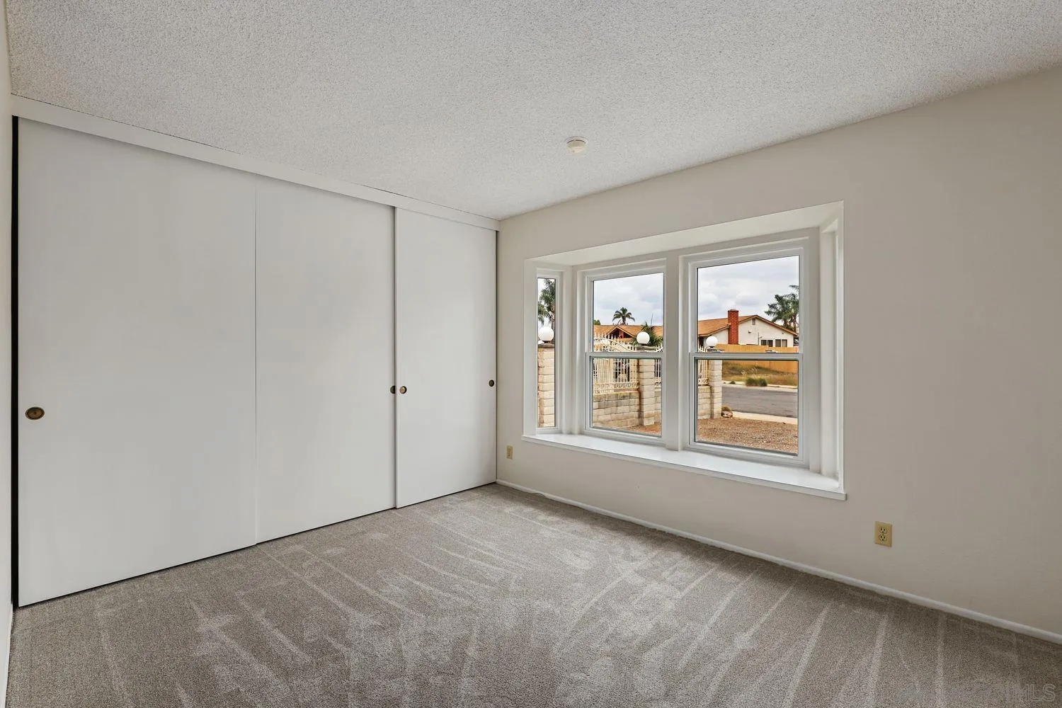 7912 Hemphill Drive San Diego, CA 92126 - Photo 15 of 17 a view of an empty room with a window