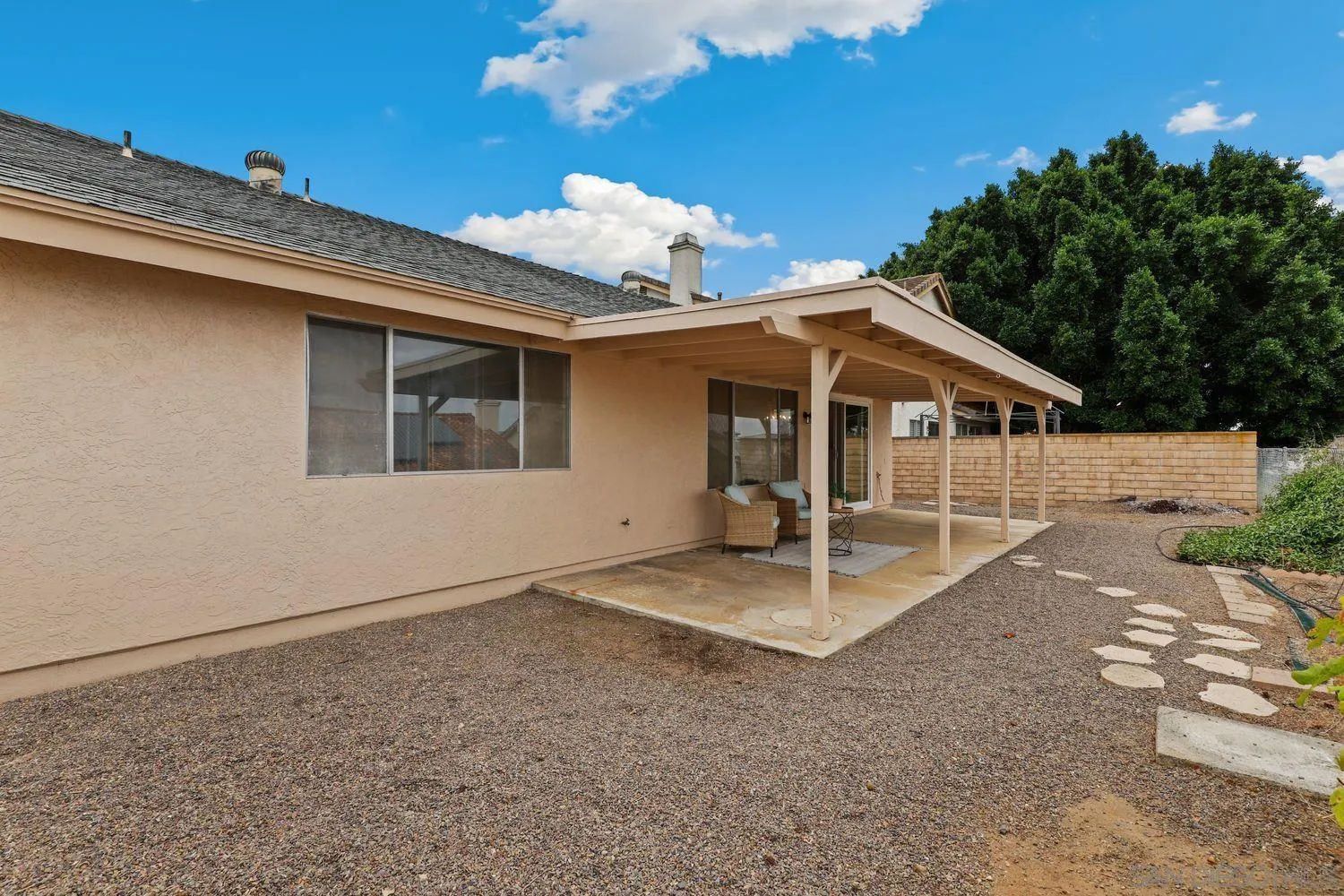 7912 Hemphill Drive San Diego, CA 92126 - Photo 17 of 17 a view of a house with a backyard and porch