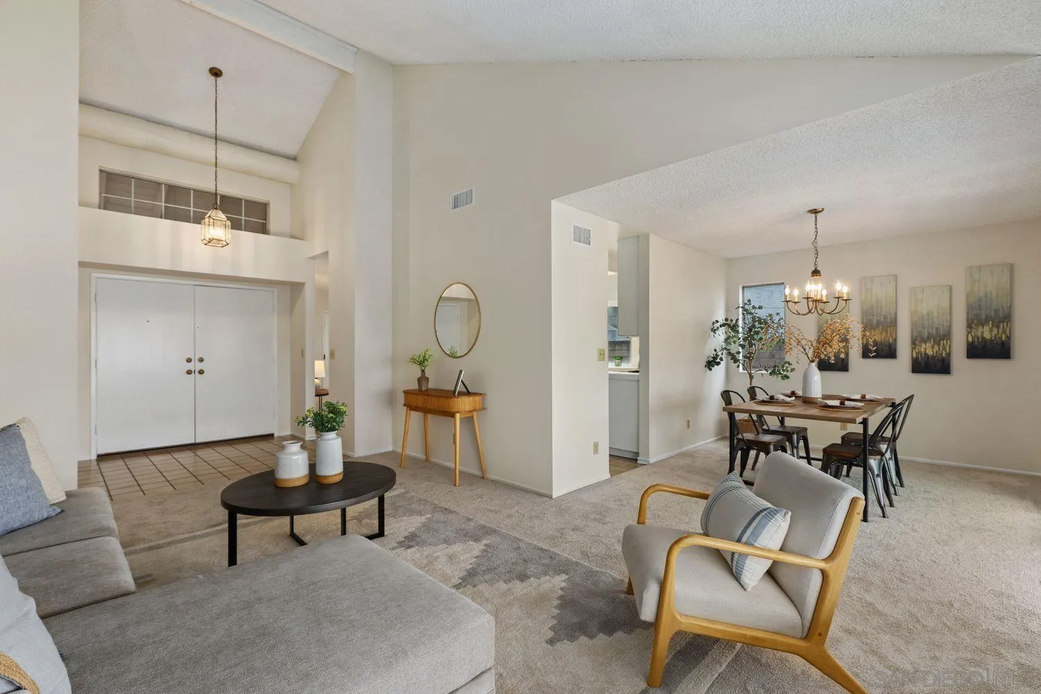 7912 Hemphill Drive San Diego, CA 92126 - Photo 4 of 17 a living room with furniture and a chandelier