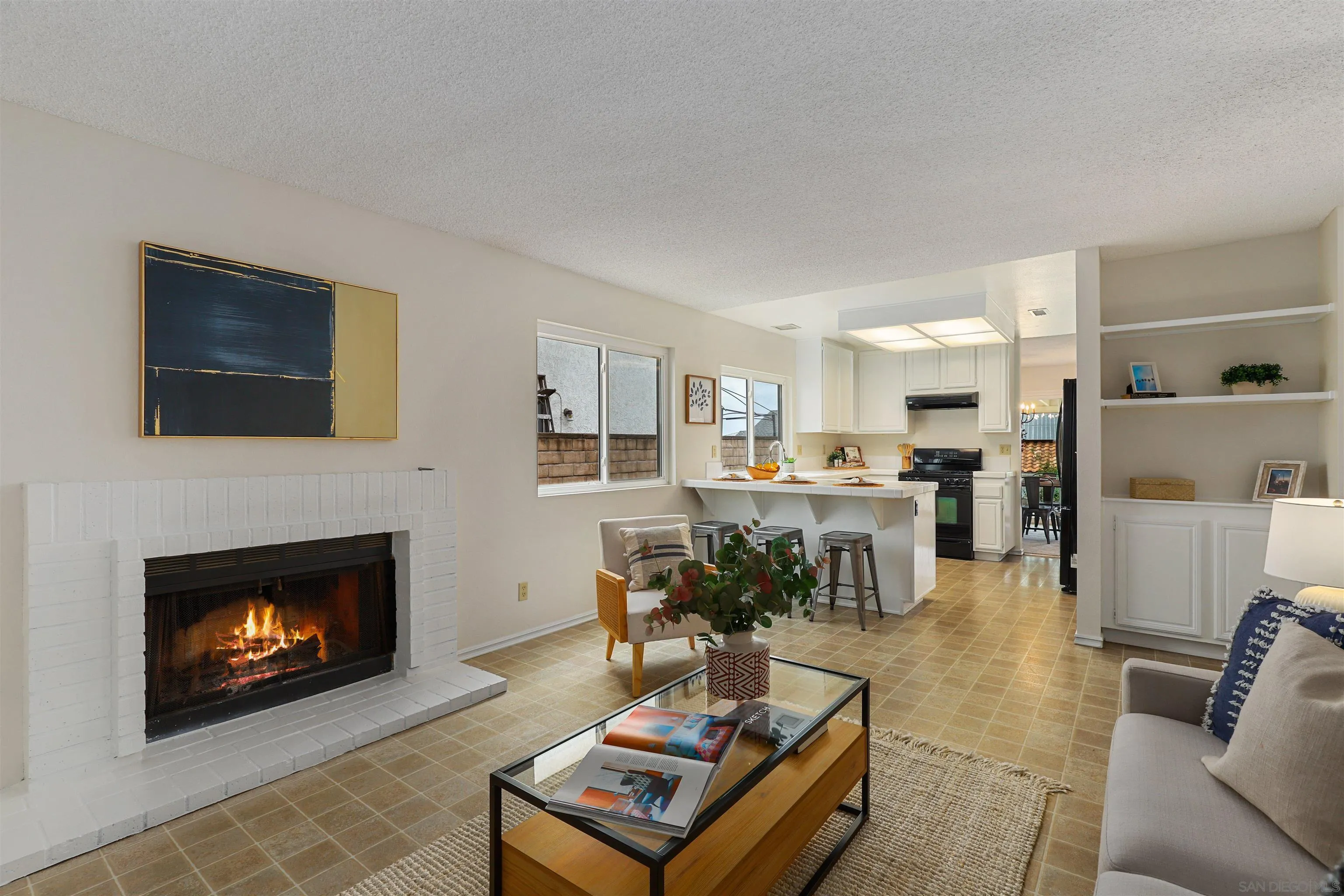 7912 Hemphill Drive San Diego, CA 92126 - Photo 5 of 17 a living room with furniture and a fireplace