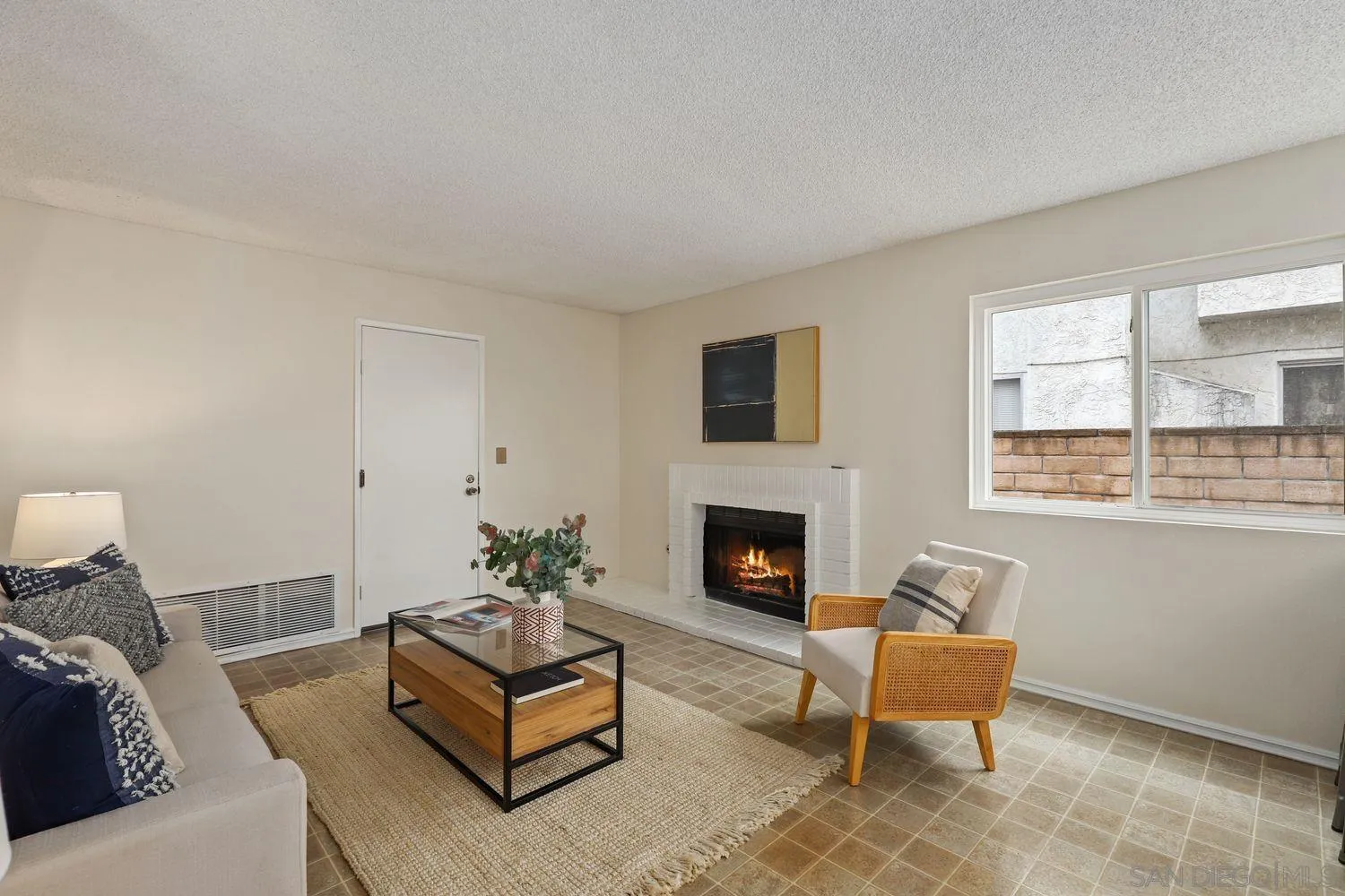 7912 Hemphill Drive San Diego, CA 92126 - Photo 6 of 17 a living room with furniture and a fireplace