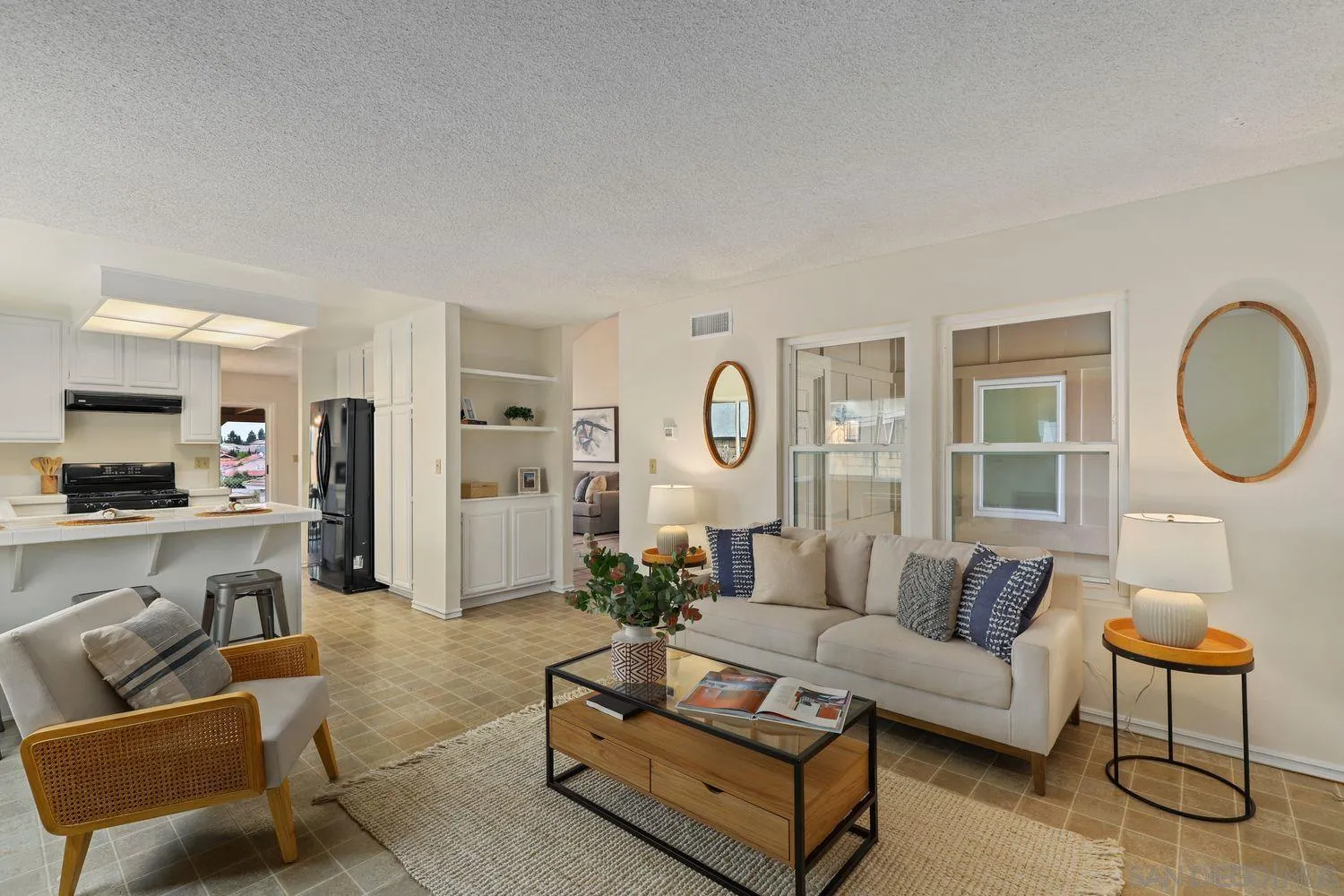 7912 Hemphill Drive San Diego, CA 92126 - Photo 7 of 17 a living room with furniture and a large window