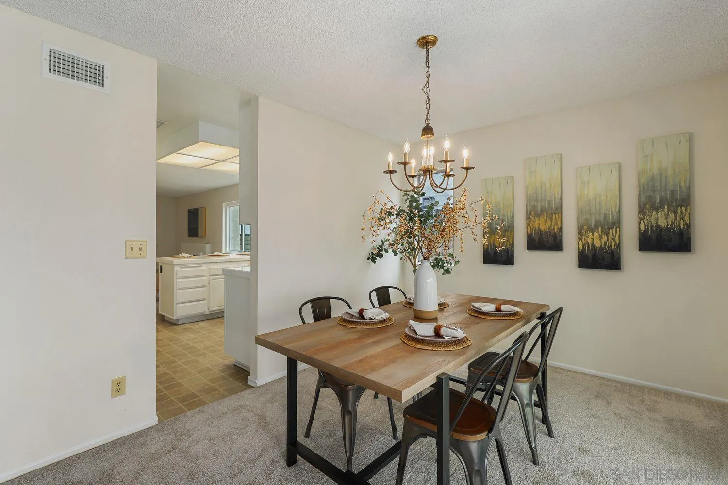 7912 Hemphill Drive San Diego, CA 92126 - Photo 8 of 17 a view of a dining room with furniture and chandelier
