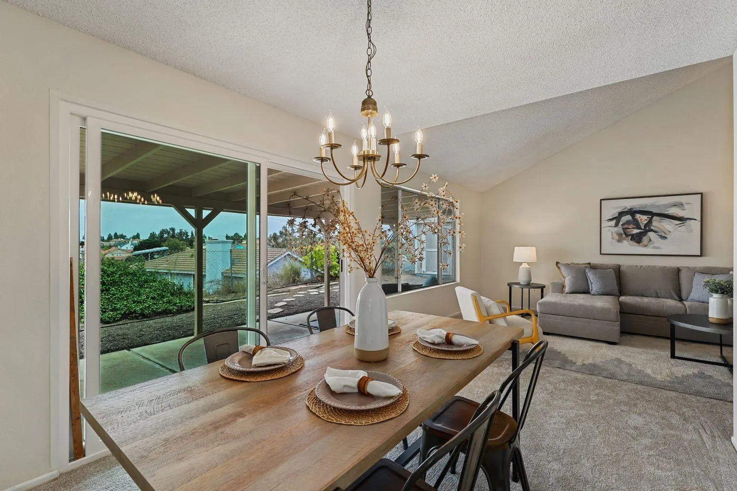 7912 Hemphill Drive San Diego, CA 92126 - Photo 9 of 17 a view of a dining room with furniture wooden floor and chandelier