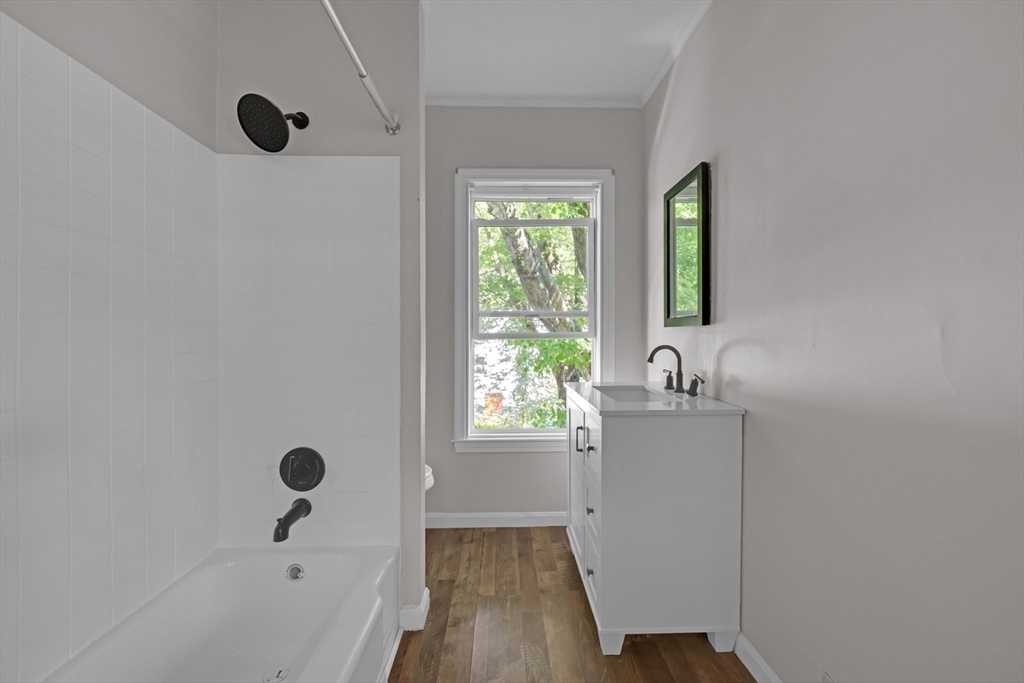 47 Morris Street Southbridge, MA 01550 - Photo 16 of 40 a bathroom with a tub sink and window