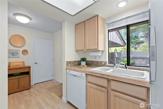 a kitchen with a sink and a window