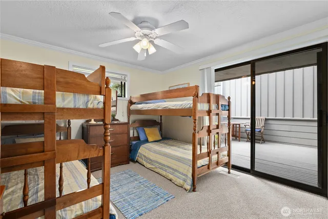 a bedroom with furniture and a chandelier