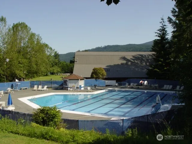 a view of a swimming pool with a patio
