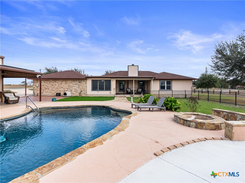 782 Santa Clara Loop Marion, TX 78124 - Photo 20 of 48 a view of a swimming pool with lawn chairs and a yard