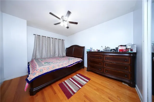 a bedroom with a bed and cabinet
