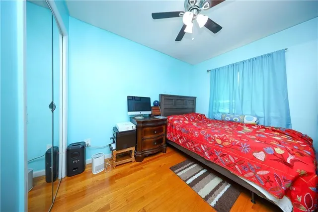 a bed room with a bed and a chandelier